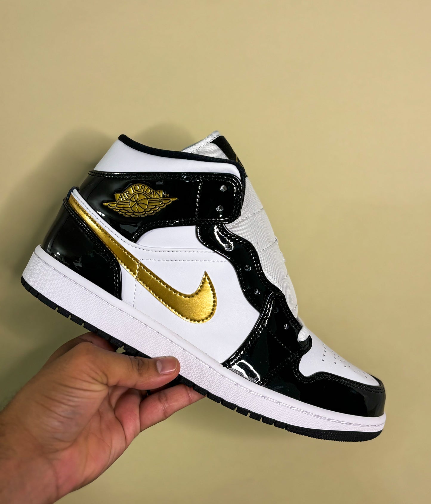 Jordan 1 Mid "Patent Black White Gold"